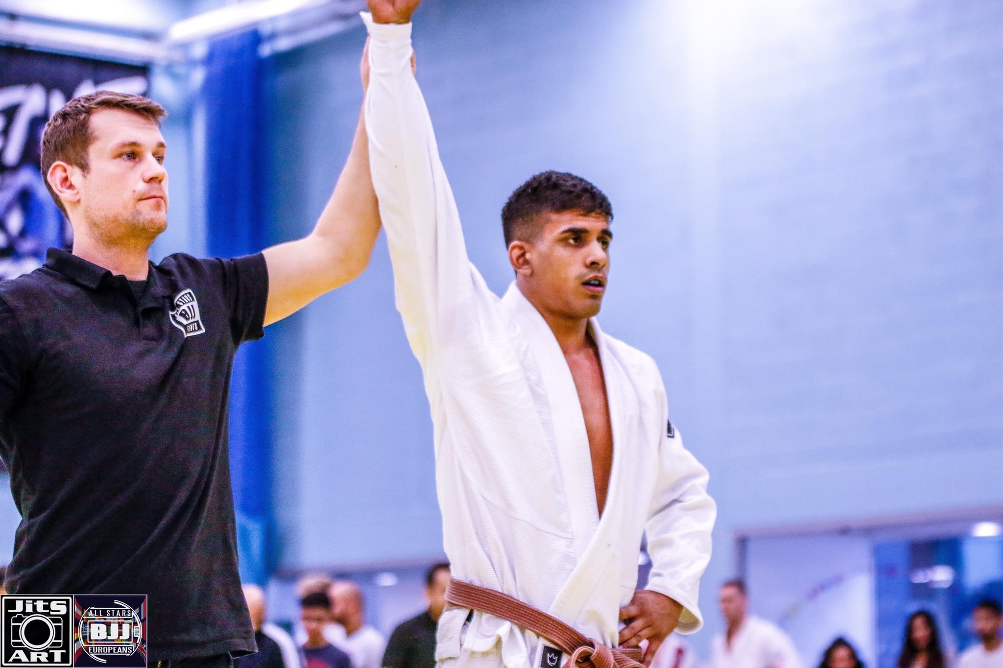 Nick with hand raised after a win
