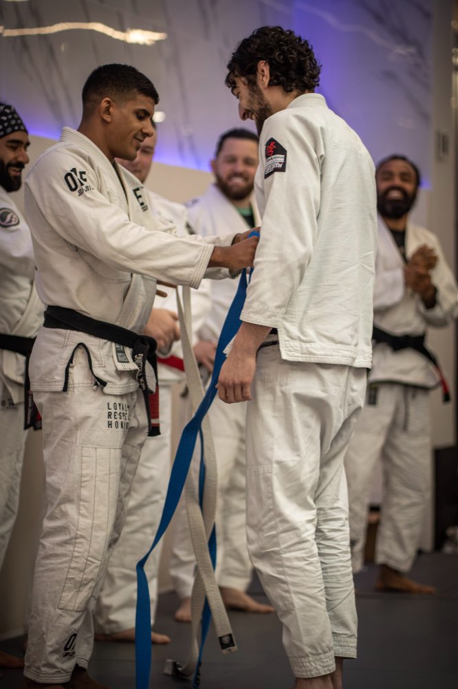 Nick promoting a student to a new belt