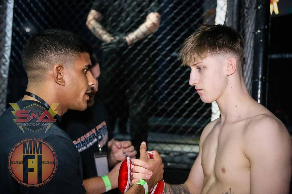 Nick wrapping hands cageside on fight night